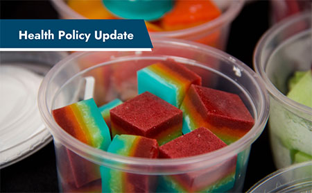 Colorful cube-shaped jellies in plastic containers with a "Health Policy Update" banner.