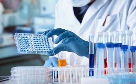 Scientist working with samples in a pharmaceutical lab